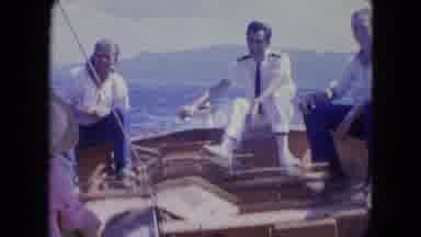 Montego Bay Jamaica (1964): Man Wearing White Shirt Steers Rocking Boat In Open