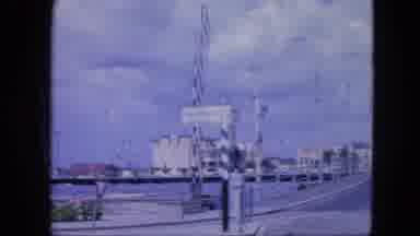 Nassau Bahamas-1964: Bridge View With Classic Cars And Pedestrians
