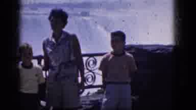 Niagra Falls Canada-1964: A Woman And Two Young Boys Standing In Front Of A