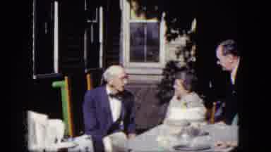 Niagra Falls New York (1964): Older Couple And Young Man Speak Together At A Table