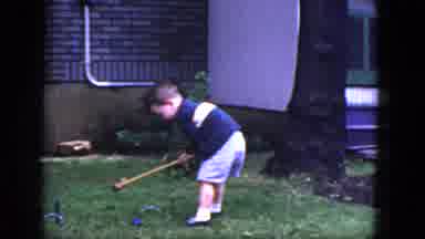 Niagra Falls New York (1964): A Little Boy Playing Croquet In His Backyard By