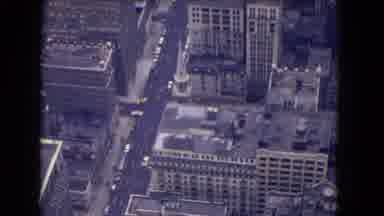 Niagra Falls New York (1964): Helicopter View Of A High Rise City With Cars