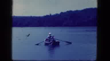 Niagra Falls New York US (1964): Men Rowing A Small Woden In A Lake Boat Near