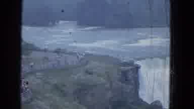 Niagra Falls US (1964): A Large Waterfall Is Panned Over From Left To Right Some