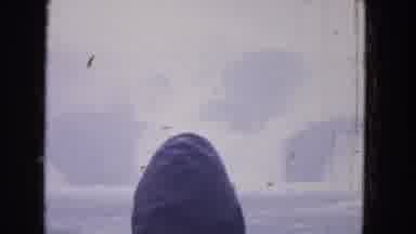 Niagra Falls US (1964): Person On Boat Looks At Snowy Landscape Obscured By Fog