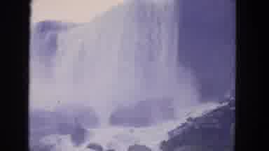 Niagra Falls US (1964): Water Falling From Heights With Buildings Nearby