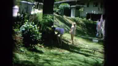 Oahi Hawaii (1964): Two Young Girls Outside A House Picking Up Cats And Bringing