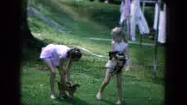 Oahi Hawaii (1964): Two Young Girls Playing With Two Small Puppies In The Yard