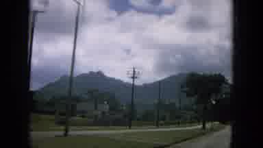 Oahi Hawaii (1964): One Vehicle Is Running In The Road Near The Mountain Is