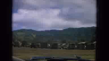 Oahi Hawaii (1964): A Land With Lot Of Arch Shaped Sheds And Trees Near To The