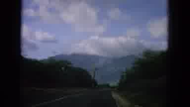 Oahi Hawaii (1964): Driving Footage Approaching A Scenic View Of Cliffs Appearing