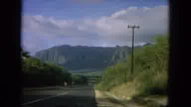 Oahi Hawaii (1964): View Of Green Mountains And Blue Sky On A Sunny Day