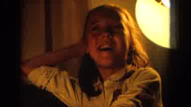 Oahi Hawaii (1964): A Girl Sits Under A Light Indoors Followed By A Man With A Dog