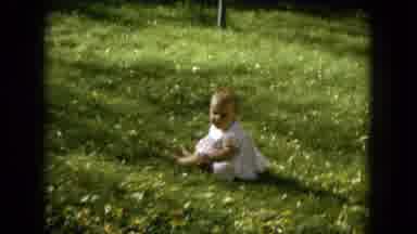 Oahi Hawaii (1964): Small Baby Child In White Dress Outfit In Grass Field Zoom In