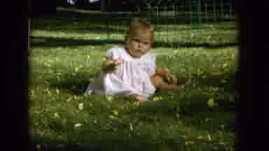 Oahi Hawaii (1964): Infant Plays And Laughs In The Grass Smiling And Waving Its