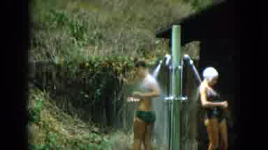 Oahi Hawaii (1964): People In Swimwear Using Outdoor Shower Cut Away To Girls