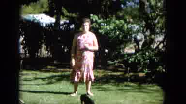Oahi Hawaii (1964): Beautiful Lady In Floral Dress Posing With Her Puppy In A