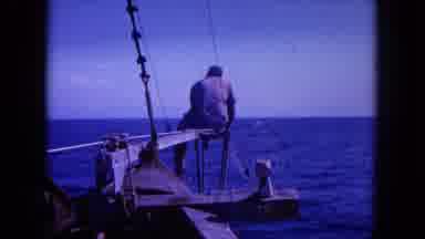 Oahi Hawaii (1964): Person Sitting Off The Edge Of A Boat In The Middle Of The Sea