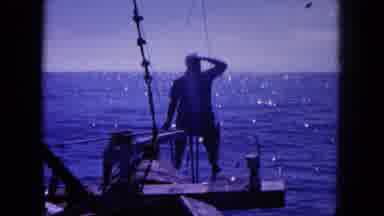 Oahi Hawaii (1964): A Man On A Fishing Boat Gazes At The Horizon As A Navy