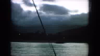 Oahi Hawaii (1964): Water View From Boat Of Pyramids Under Dark Cloudy Skies