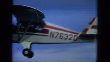 Oahi Hawaii (1964): White With Red Stripe Single Engined Cessna Airplane Flying