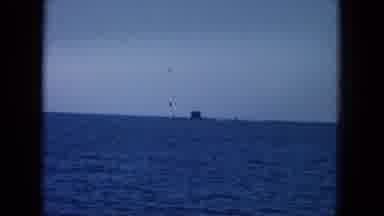 Oahi Hawaii (1964): A Man Sits At The Front Of A Boat In The Ocean