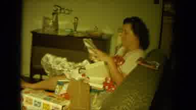 Oahi Hawaii (1964): Middle Age Lady Opening Many Gifts From Friends And Family