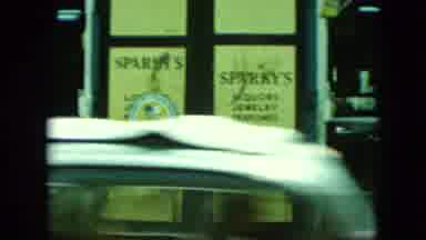 Saint Thomas (1964): Sparky Head Scarf Sitting At A Restaurant Eating Chairs Table