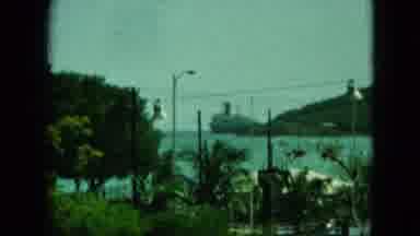 Saint Thomas (1964): View Of A Harbor With Cars Trees And People In The Foreground