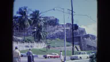 SAN JUAN PUERTO RICO.-1964: Pedestrians Walk Along Road Near Historic Fortress