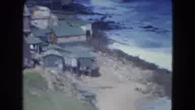 SAN JUAN PUERTO RICO.-1964: A View Of A Coastal Town With Waves And Hillside Homes
