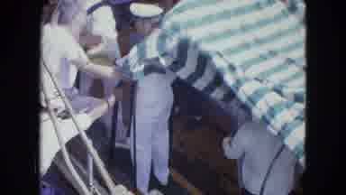 SAN JUAN PUERTO RICO.-1964: Man Boarding A Small Boat With A Green And White