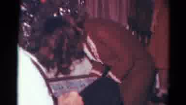 Toledo Ohio (1964): Family Handing Christmas Gifts To Family Members So They Can