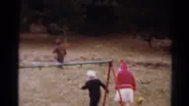 Toledo Ohio (1964): Three Young Children Run Through A Playground Near Swings That