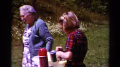 Toledo Ohio (1964): An Older Woman Stands Beside A Younger Woman Who Is Working To