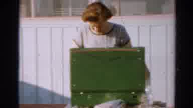 Toledo Ohio (1964): Lady With Red Hair Looks In Green Suitcase