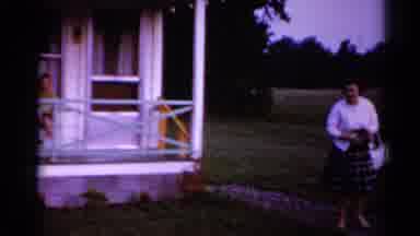 Toledo Ohio (1964): Woman Comes Around The House As Another Exists The House