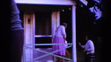 Toledo Ohio (1964): Younger Woman Helps Older Woman Down The Stairs Leaving The