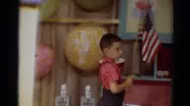 Toledo Ohio (1964): Boy Wearing Red Shirt And Black Pants Holds American Flag