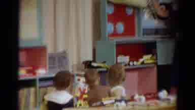 Toledo Ohio (1964): Children Bunny Hopping Around A Classroom While The Teacher
