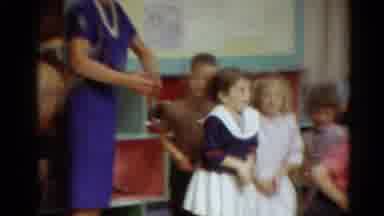 Toledo Ohio (1964): Teacher Observes Class Of Small Children Bouncing While