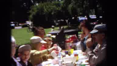 Toledo Ohio (1964): Large Family Sitting At A Picnic Table Outside Enjoying A Meal