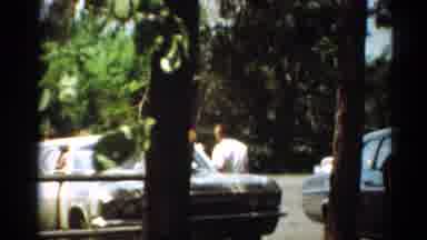 Toledo Ohio (1964): Nice Weather Sunglasses Women Running Men Talking Pipe Smoking