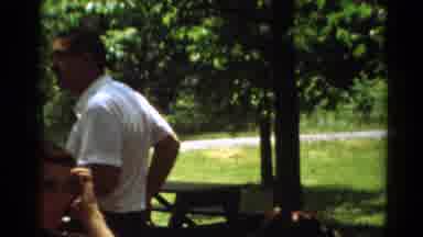 Toledo Ohio (1964): People Sitting At Picnic Tables In The Park Looking In The