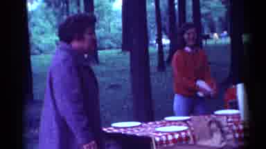 Toledo Ohio (1964): A Picnic Table With Disposable Dishes On It Is Shaken By A Man