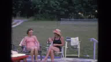 Troy New York (1964): Two Women Sit Poolside While Wearing Swim Attire And Have A