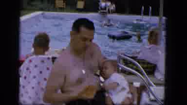 Troy New York (1964): A Hairy Man Wearing A Necklace Trying To Feed A Crying Baby
