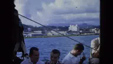USA Virgin Islands (1964): Four Men Visible On A Boat Ride Showing A City In The