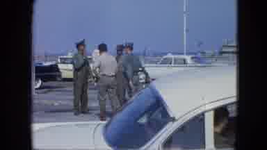 Venezula (1964): Men Are Conversing On A Dock Near The Ocean Shore