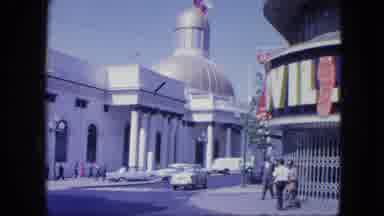VENEZULA-1964: White Building With Golden Dome And Classic Cars
